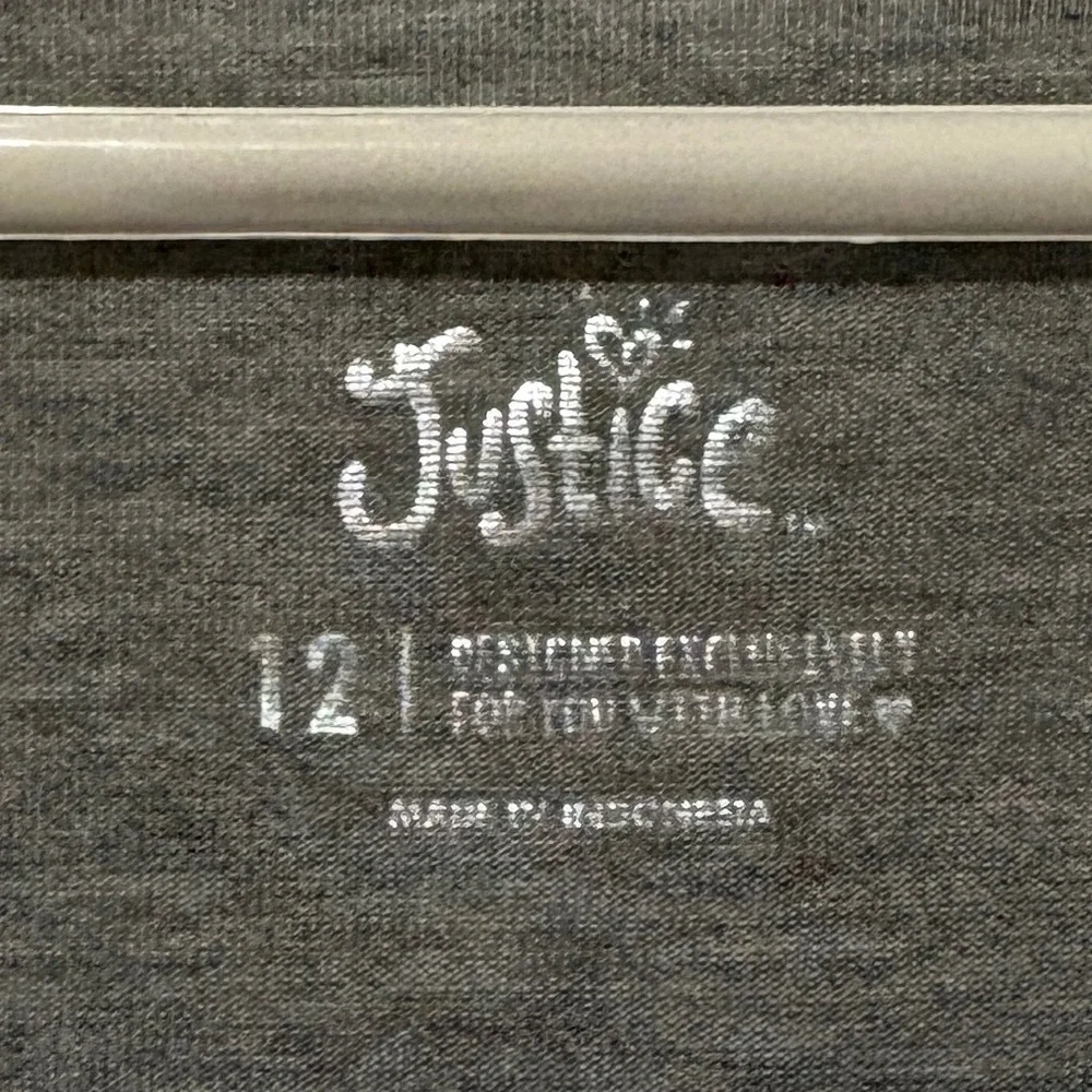Beautiful Justice top with white decorative detail